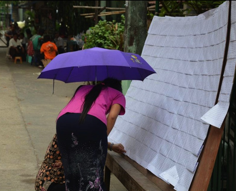 Burmeses voters looking at the candidate boards