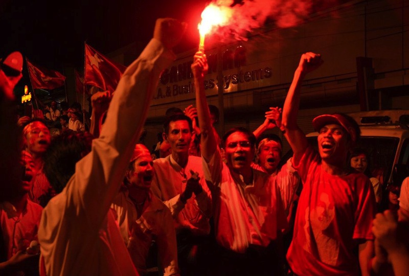 NLD supporters rally together as night falls on the polling day