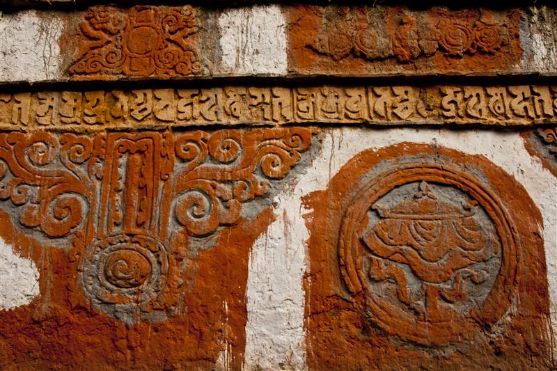 A wall of the monastery that showcases Buddhist textures, showcasing Upper Mustang's richness.