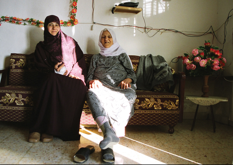 Aliya, a cluster bomb victim, with her mother, Adchit, Lebanon