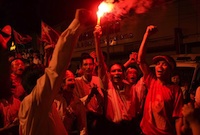 NLD supporters rally together as night falls on the polling day
