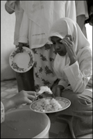 A girl gets her lunch at an orphanage in Banda Aceh Indonesia