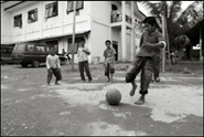 Boys playing football at an orphanage in Banda Aceh Indonesia